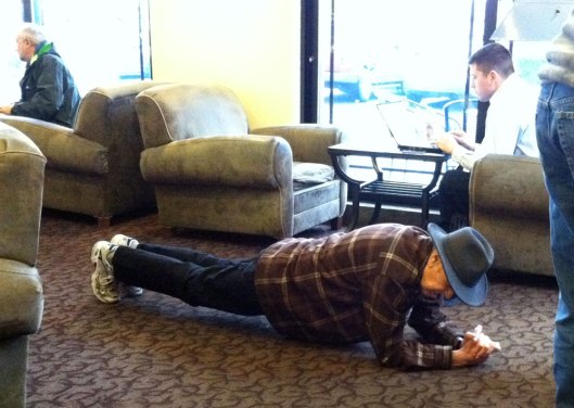 Carl Mathews in a plank position at the coffee shop. He just needed to stretch and get the blood flowing!